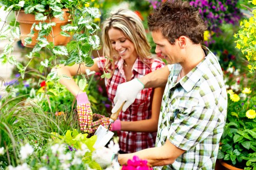Professional landscaper designing a garden layout in Hammersmith